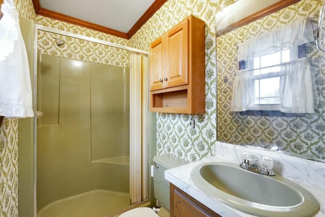 bathroom with an enclosed shower, toilet, a textured ceiling, vanity, and ornamental molding