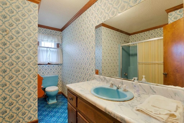 bathroom featuring a textured ceiling, vanity, toilet, and ornamental molding