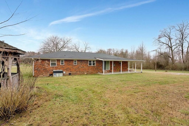 back of house featuring a yard