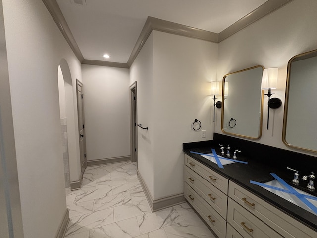 bathroom with vanity and ornamental molding