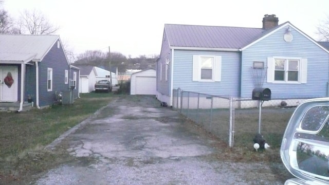 view of side of home with an outbuilding and a garage