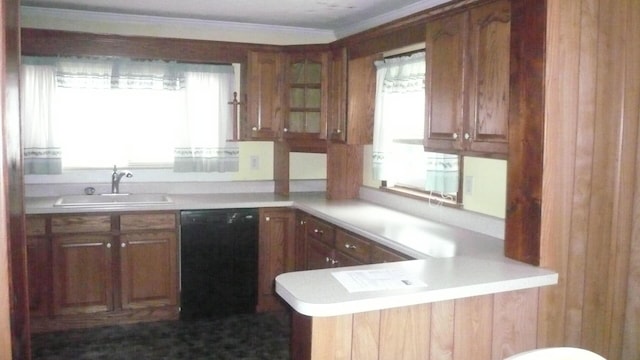 kitchen featuring a healthy amount of sunlight, sink, kitchen peninsula, and black dishwasher