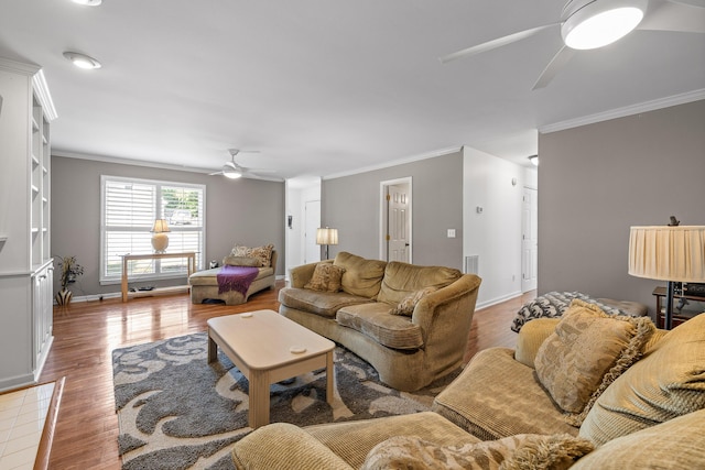 living room featuring hardwood / wood-style flooring, ceiling fan, and ornamental molding