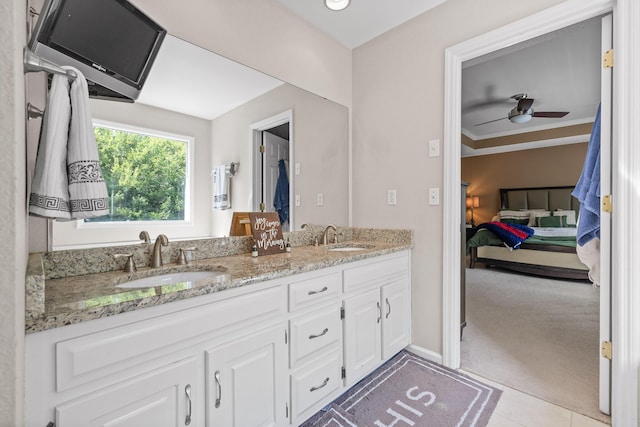 bathroom featuring tile patterned flooring, vanity, ceiling fan, and crown molding