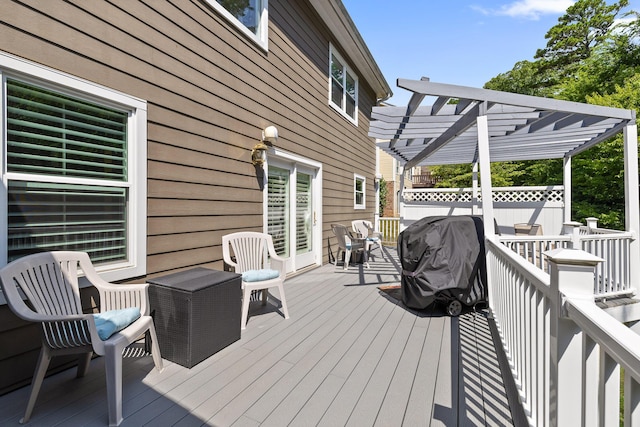 deck featuring area for grilling and a pergola