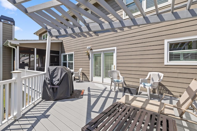 deck featuring a pergola and grilling area