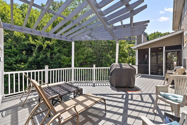 wooden deck with a pergola, area for grilling, and a sunroom