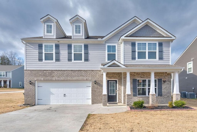 craftsman house with a garage and a front yard