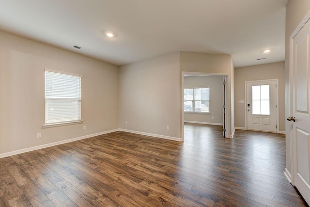 unfurnished room with dark hardwood / wood-style floors