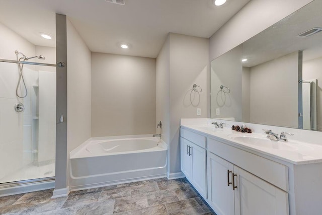 bathroom featuring plus walk in shower and vanity