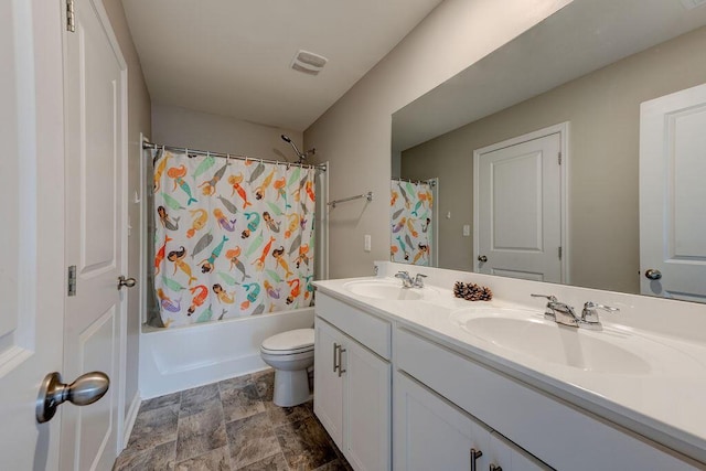 full bathroom featuring vanity, toilet, and shower / bath combo with shower curtain