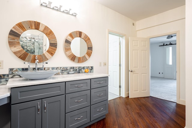 bathroom with wood-type flooring and vanity