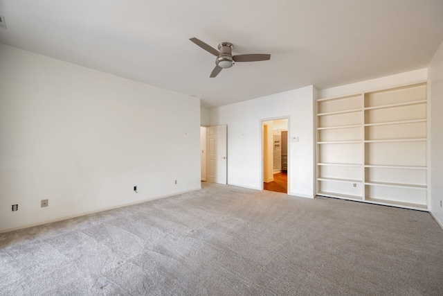 unfurnished bedroom with ceiling fan and carpet