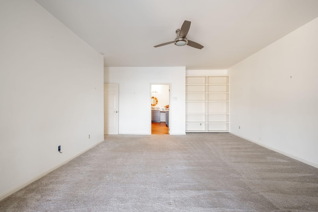 unfurnished bedroom featuring ceiling fan and light colored carpet