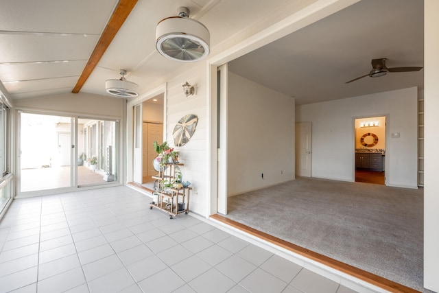 interior space with ceiling fan, light colored carpet, and lofted ceiling with beams