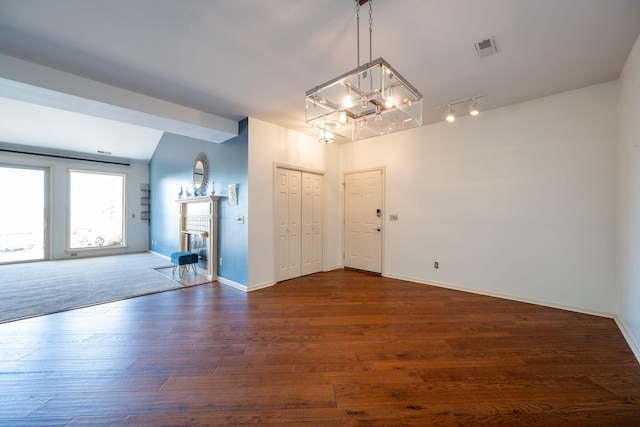 spare room featuring dark wood-type flooring