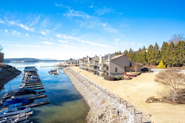 property view of water with a dock