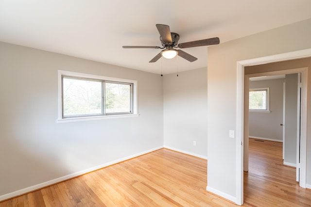 spare room featuring ceiling fan and light hardwood / wood-style floors