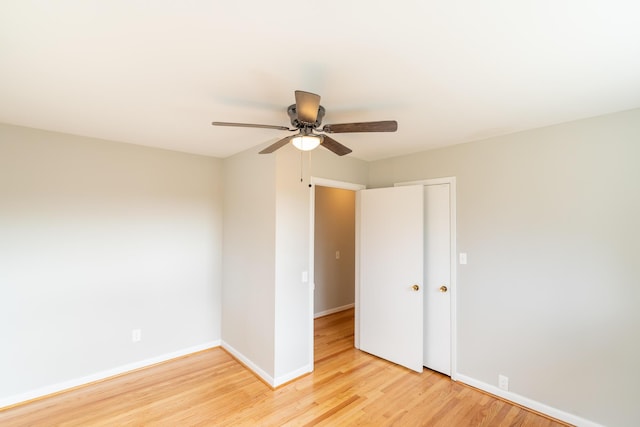 unfurnished room with ceiling fan and light hardwood / wood-style floors