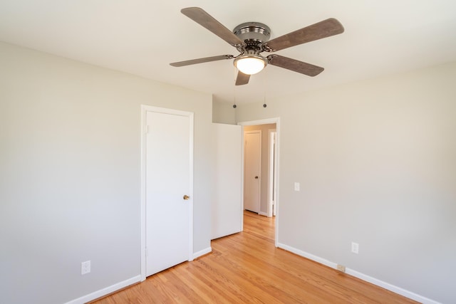 unfurnished bedroom featuring ceiling fan and light wood-type flooring