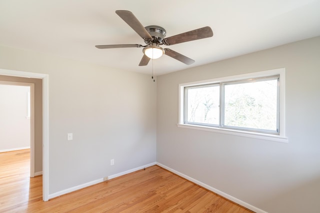 empty room with ceiling fan and light wood-type flooring