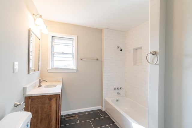 full bathroom with tile patterned flooring, vanity, toilet, and tiled shower / bath