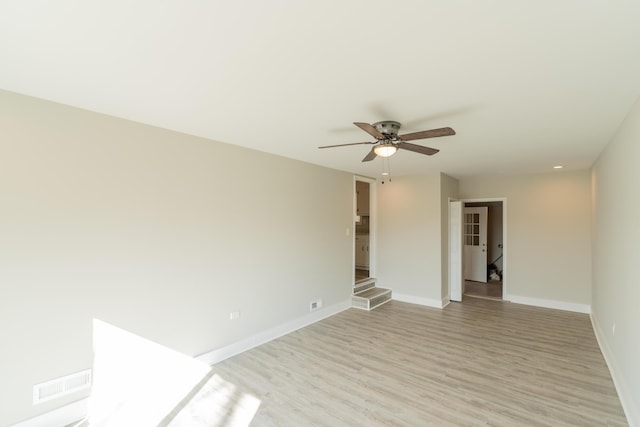 unfurnished room with ceiling fan and light wood-type flooring