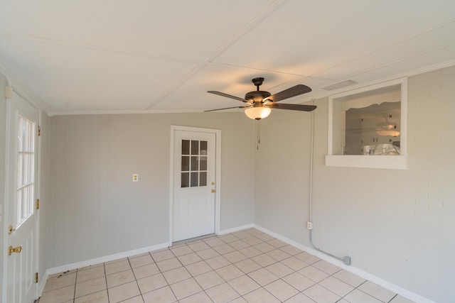 spare room with ceiling fan and light tile patterned floors