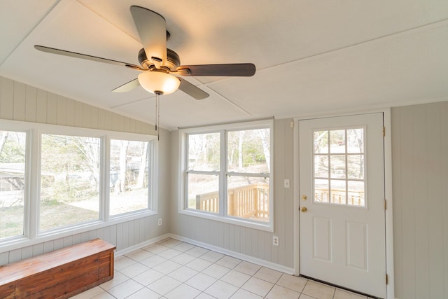 unfurnished sunroom featuring lofted ceiling and ceiling fan