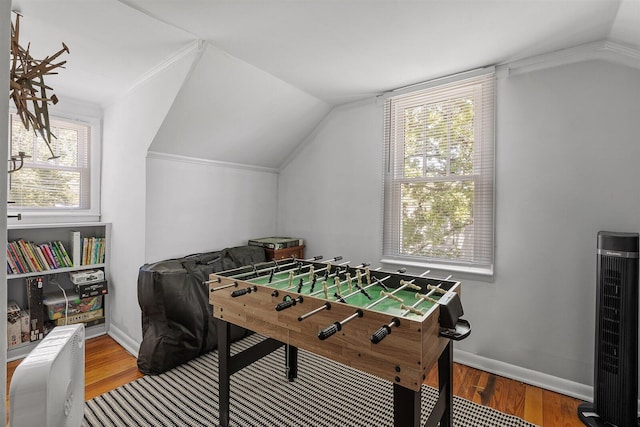 rec room featuring hardwood / wood-style floors and vaulted ceiling