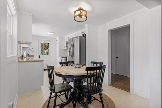 tiled dining space with sink