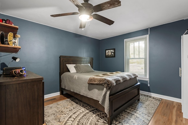 bedroom featuring ceiling fan and light wood-type flooring