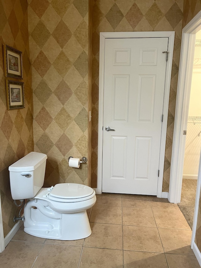 bathroom with tile patterned floors and toilet