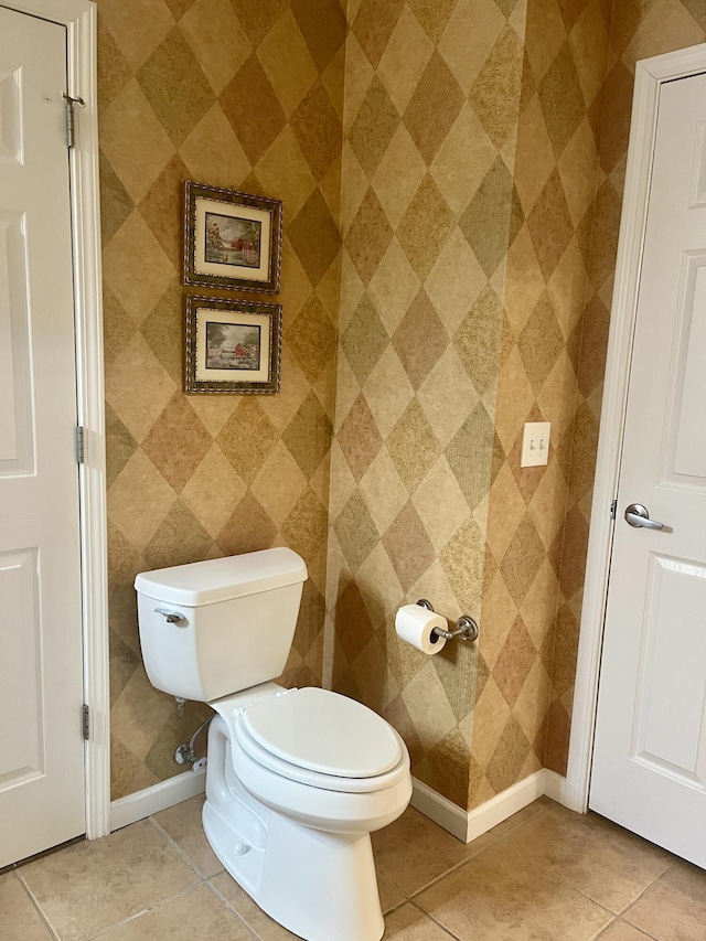 bathroom featuring toilet and tile patterned floors