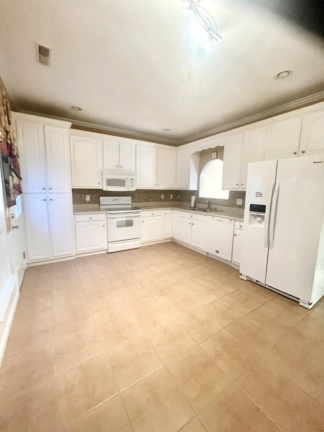 kitchen featuring white cabinets, white appliances, sink, and light tile patterned flooring