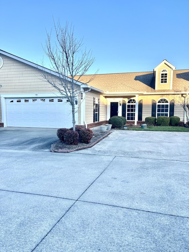 ranch-style home featuring a garage