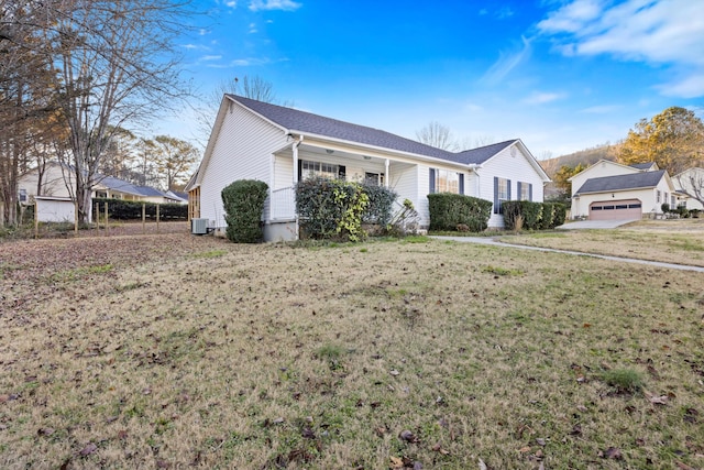 ranch-style home with central air condition unit and a front lawn