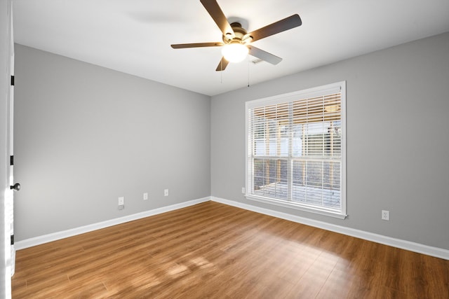 empty room featuring light hardwood / wood-style floors and ceiling fan