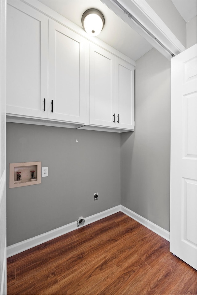 laundry room featuring cabinets, washer hookup, dark hardwood / wood-style floors, and electric dryer hookup