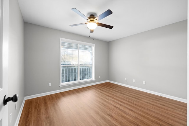 unfurnished room featuring hardwood / wood-style floors and ceiling fan