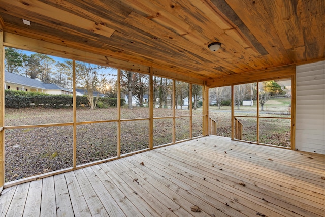 unfurnished sunroom with wooden ceiling