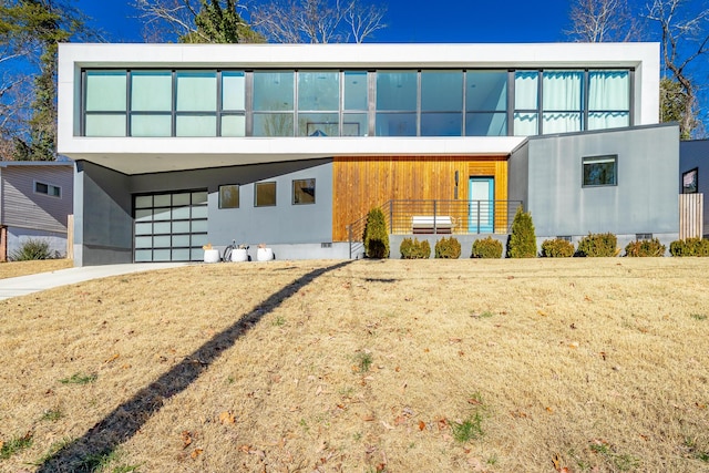 contemporary home with a front yard