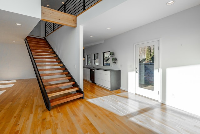 stairway featuring hardwood / wood-style flooring