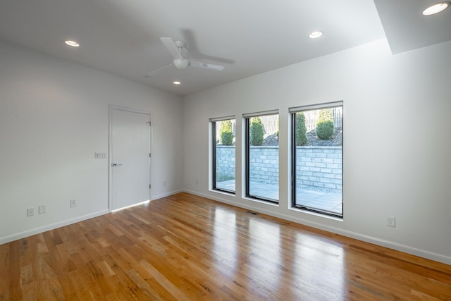 unfurnished room featuring ceiling fan and light wood-type flooring