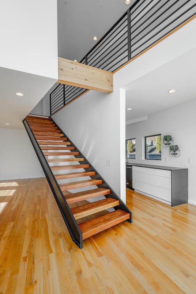 staircase featuring hardwood / wood-style floors