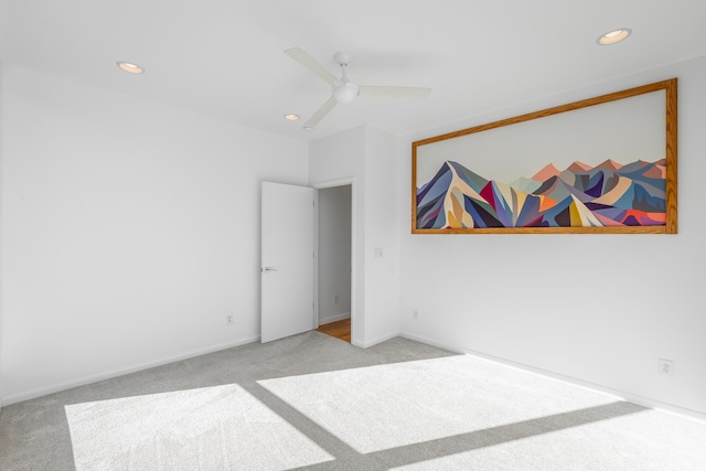 bedroom featuring light carpet and ceiling fan