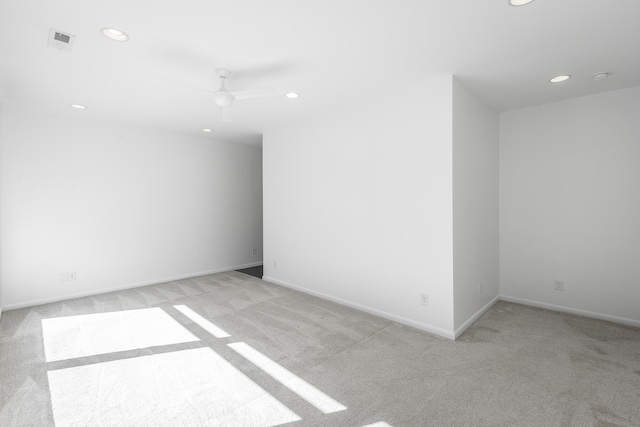 carpeted empty room featuring ceiling fan