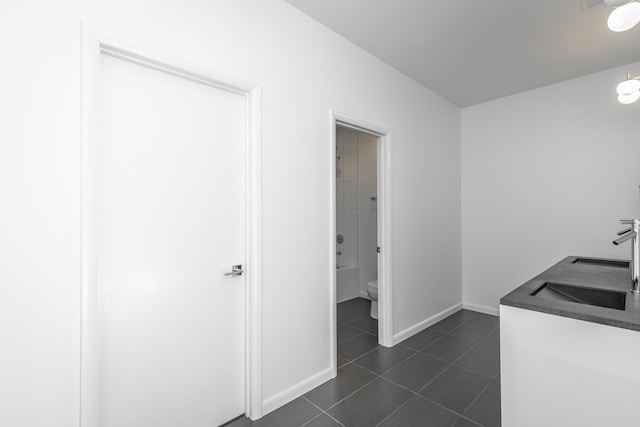 interior space with dark tile patterned floors