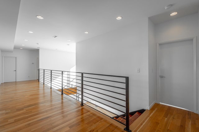 hall with light hardwood / wood-style flooring