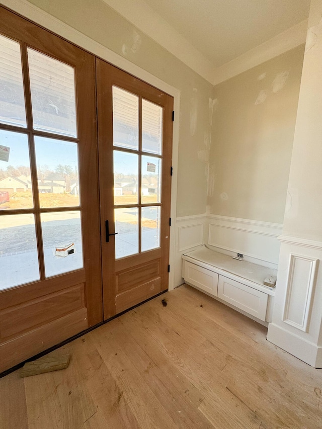 doorway featuring light wood-type flooring and french doors